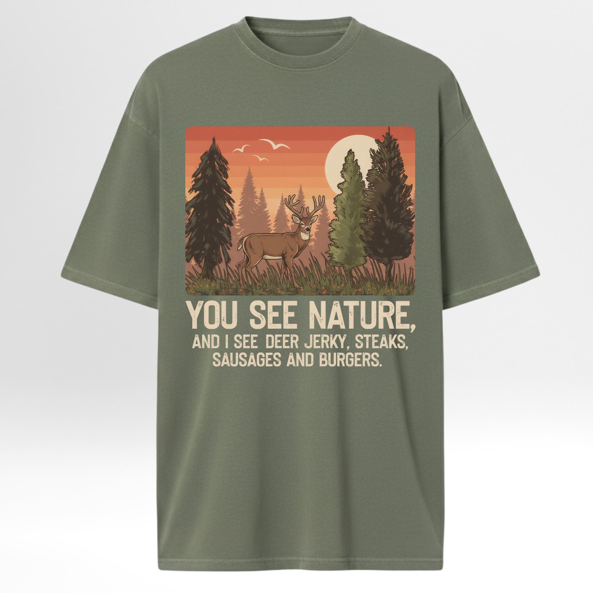 Green t-shirt with a graphic of a deer in a forest and humorous text 'You See Nature And I See A Deer Jerky Steaks Sausages And Burgers'