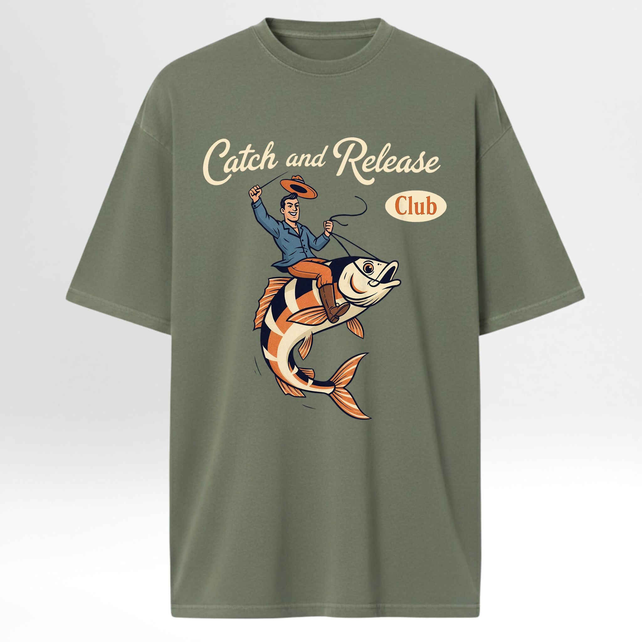 Green fishing t-shirt with a graphic of a man on a fish and 'Catch and Release Club' text.