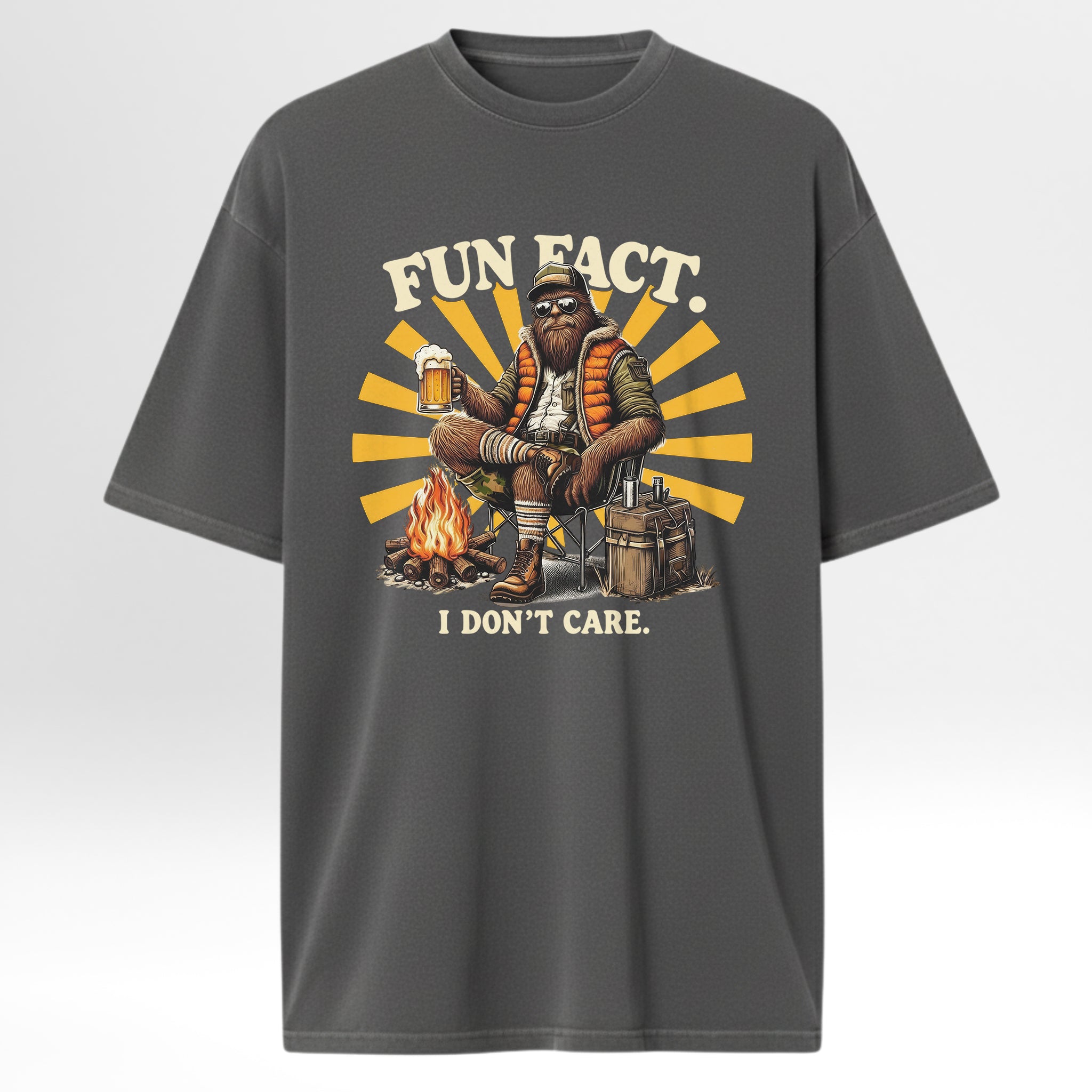 Gray camp & trail t-shirt with a graphic of a bearded man by a campfire and text 'Fun Fact, I Don't Care'.