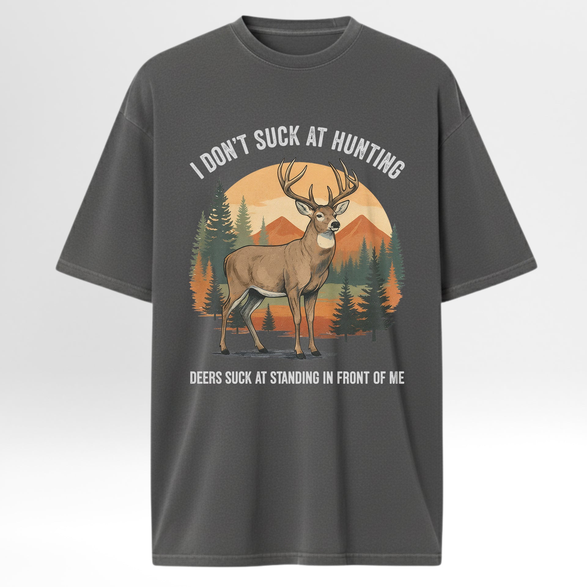 Gray hunting t-shirt with a graphic of a deer and text 'I Don't Suck At Hunting Deers Suck At Standing In Front Of Me'.