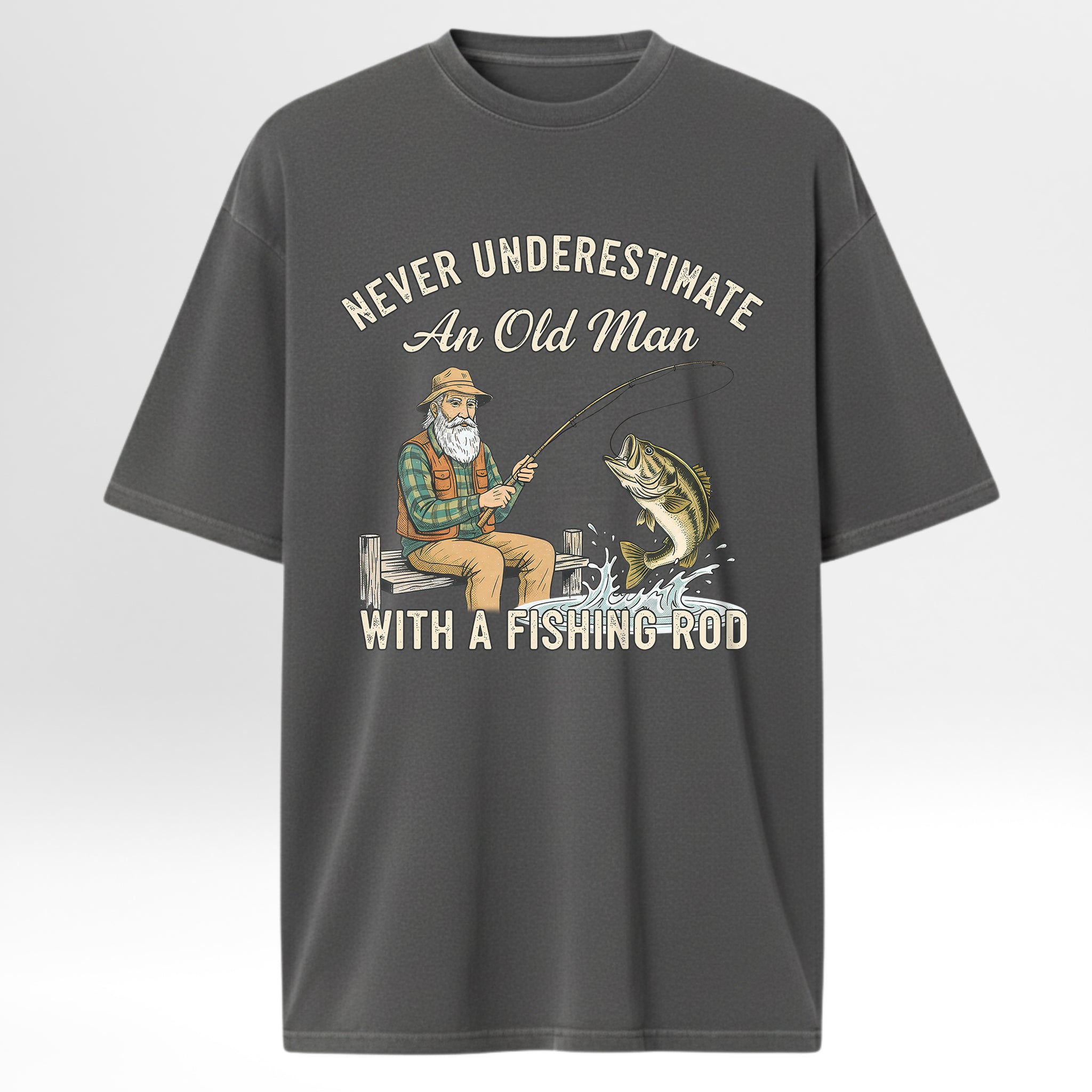 Gray fishing t-shirt with fishing graphic and text 'Never Underestimate An Old Man With A Fishing Rod'.