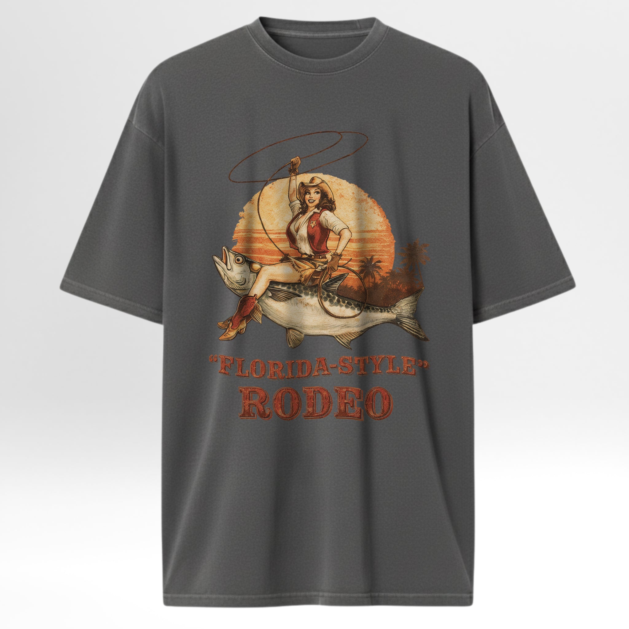 Gray fishing t-shirt with a graphic design of a woman in a cowboy hat and boots, a fish, and 'Florida Style Rodeo' text.