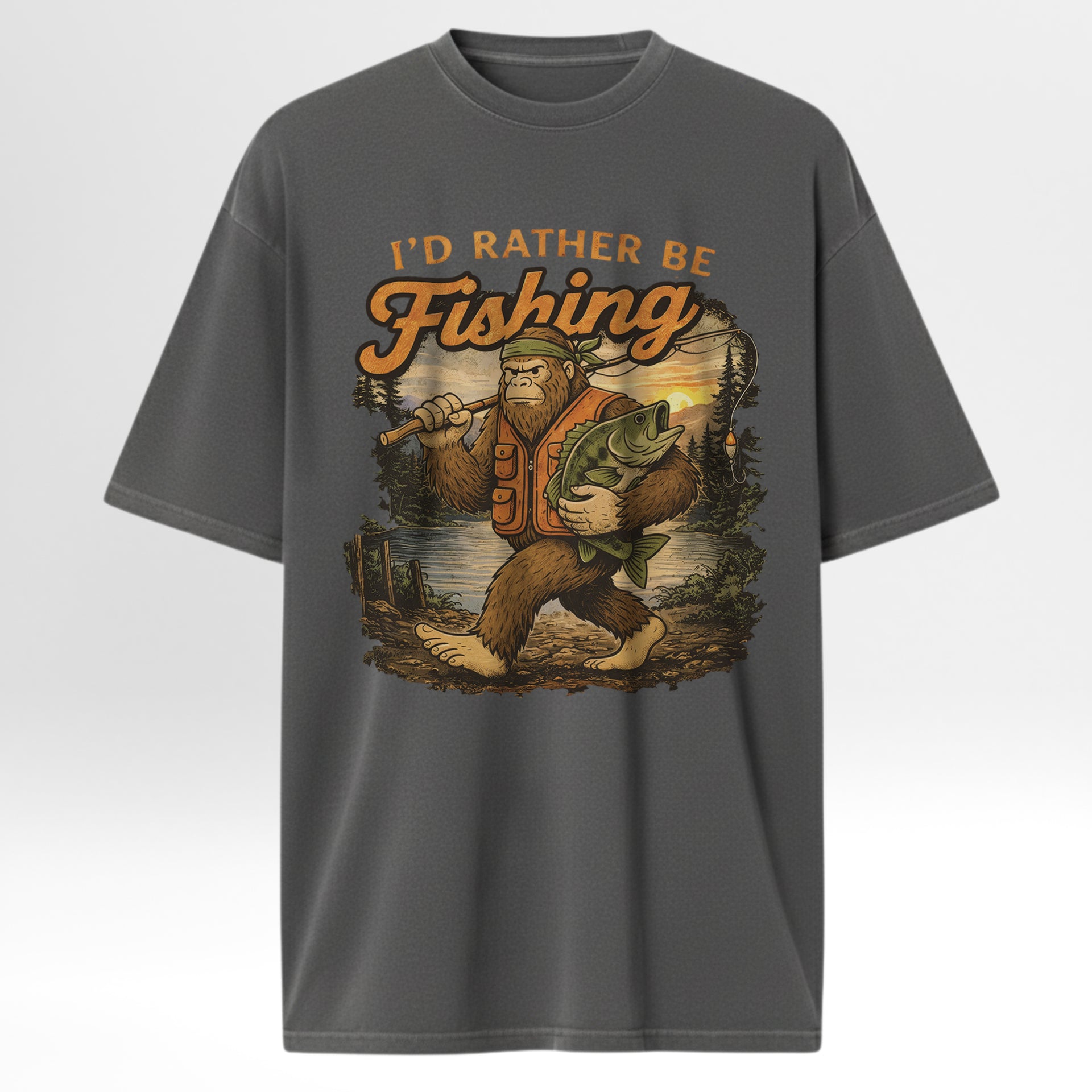 Gray fishing t-shirt with 'I'd Rather Be Fishing' graphic design featuring a Bigfoot holding a fish.