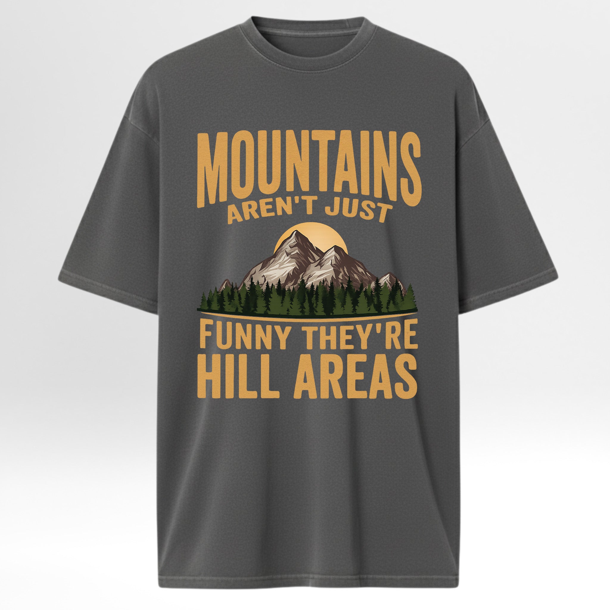 Gray t-shirt with mountain graphic and humorous text 'Mountains Aren't Just Funny They 're Hill Areas'