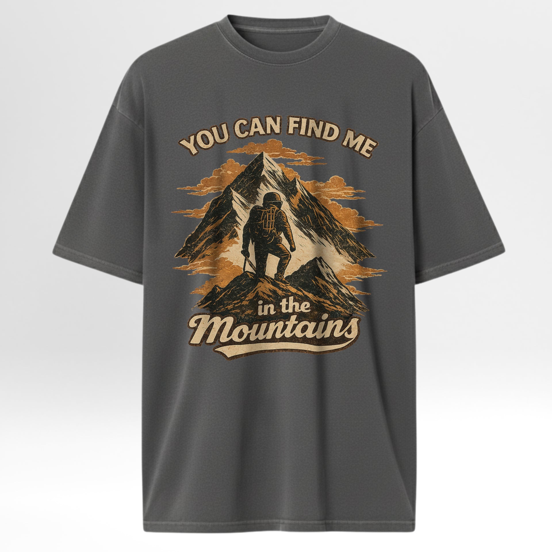 Gray outdoor t-shirt with mountain graphic and text 'You can find me in the mountains'.