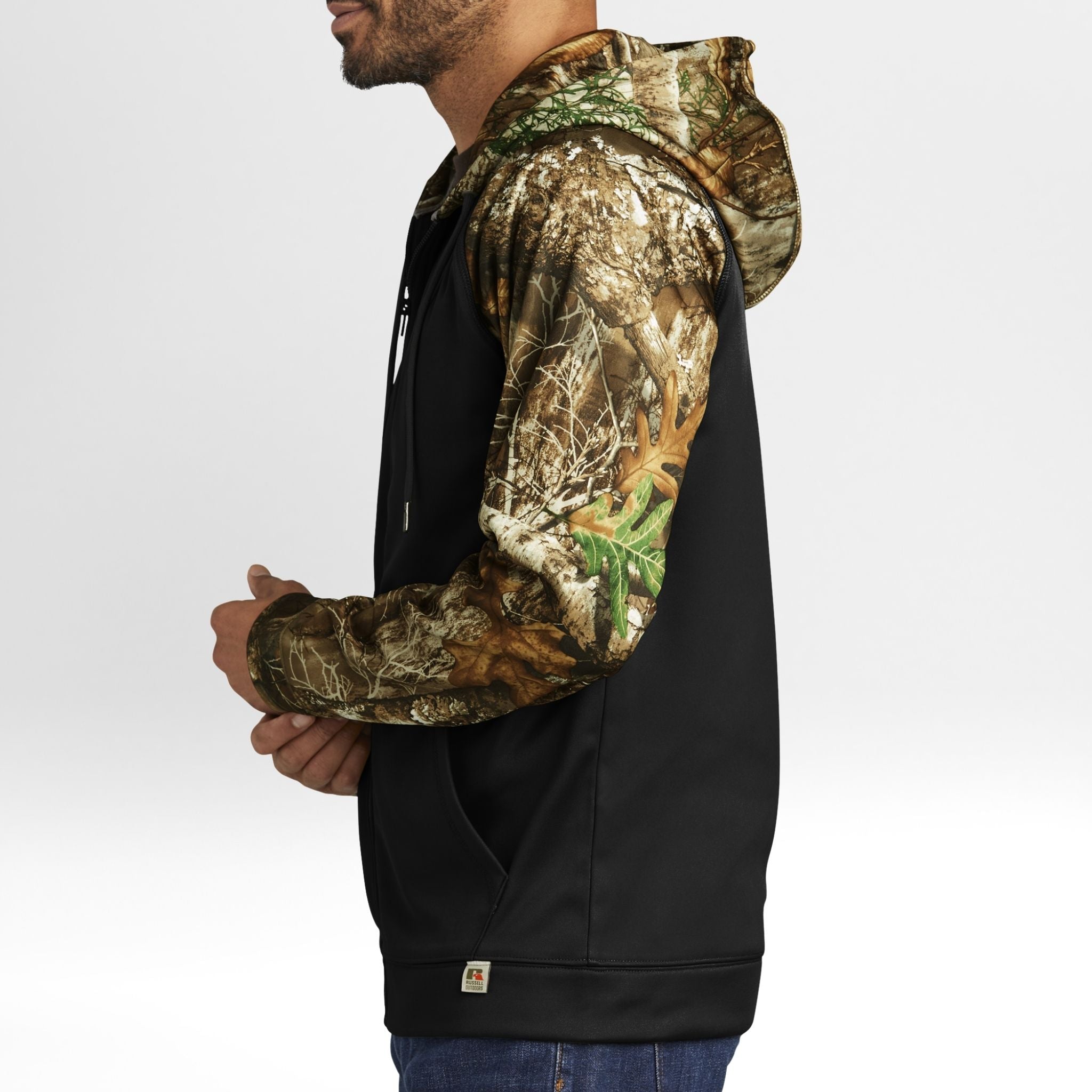 Black hoodie with Realtree Edge camouflage sleeves worn by a person on a white background
