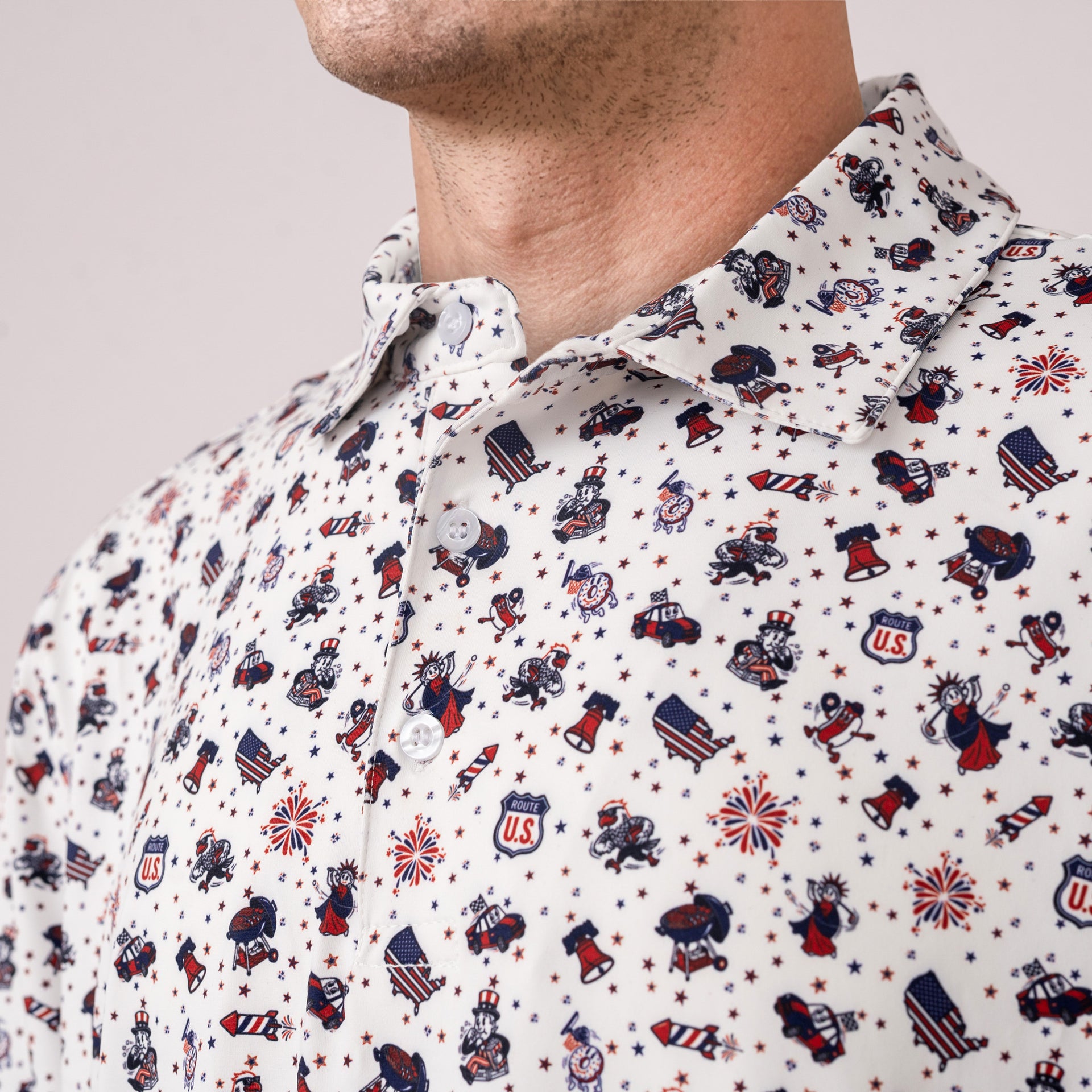 Close-up of a person wearing a patterned shirt with patriotic designs