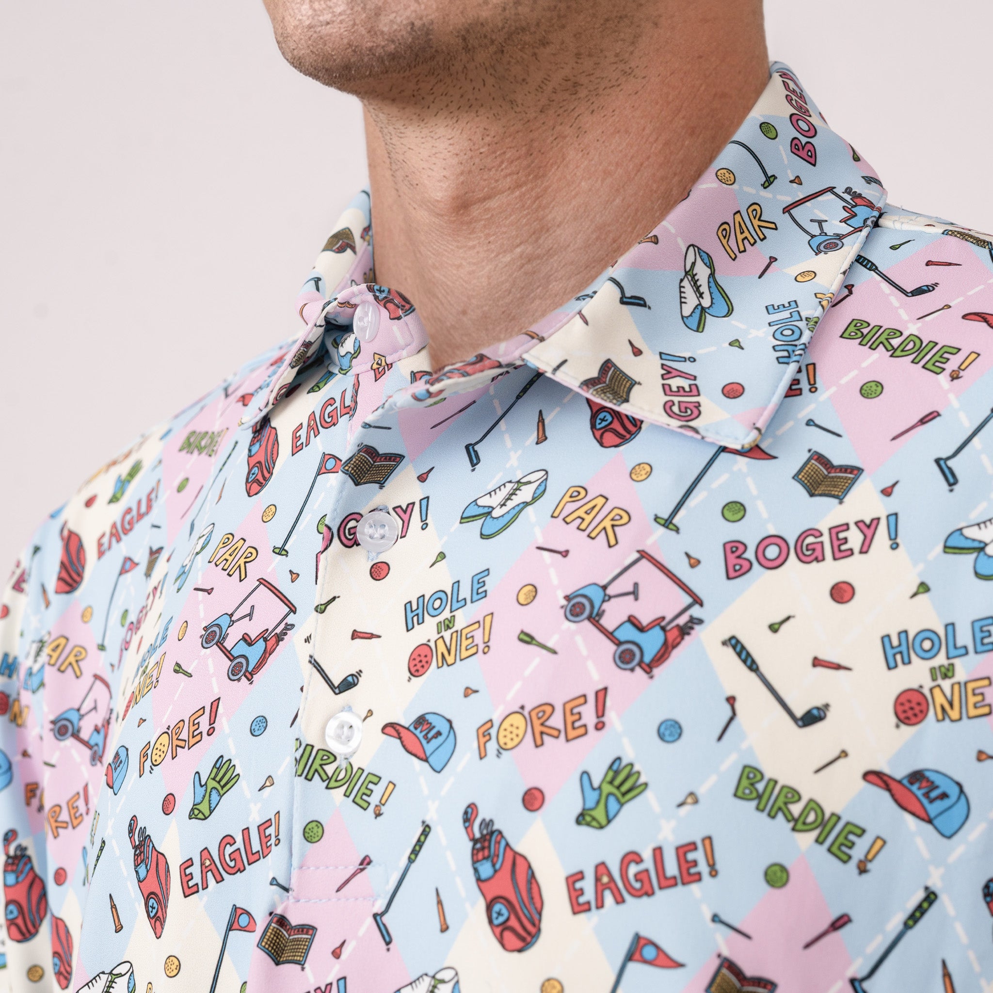Close-up of a person wearing a colorful golf-themed shirt with text and graphics.