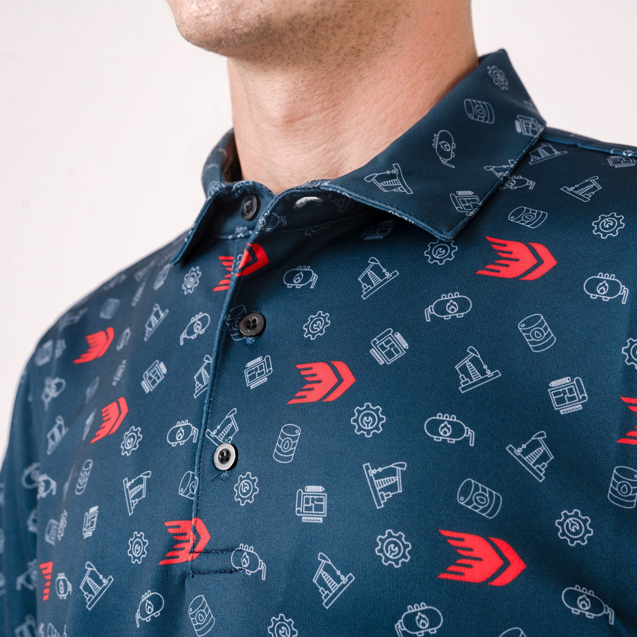 Close-up of a navy blue shirt with red and white pattern on a plain background