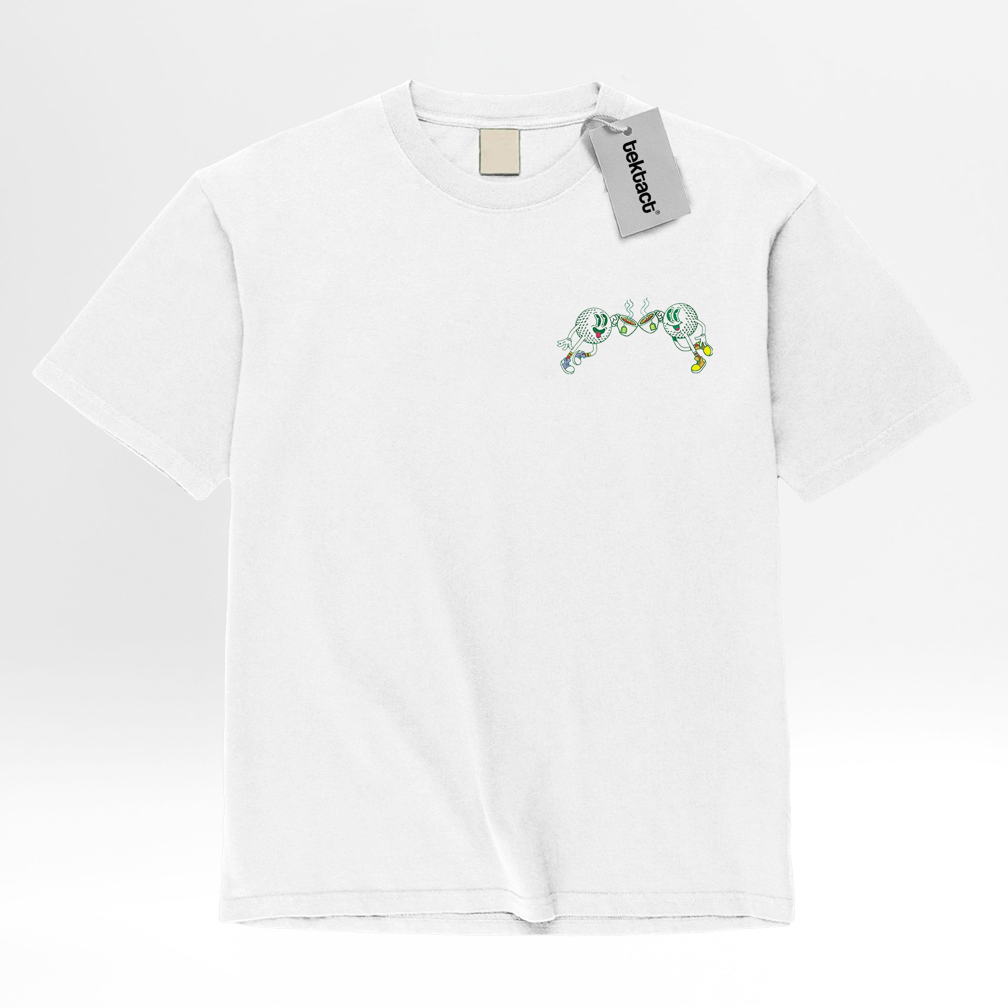 White t-shirt with green graphic design featuring golf balls and text 'Let's Meet For Tee'